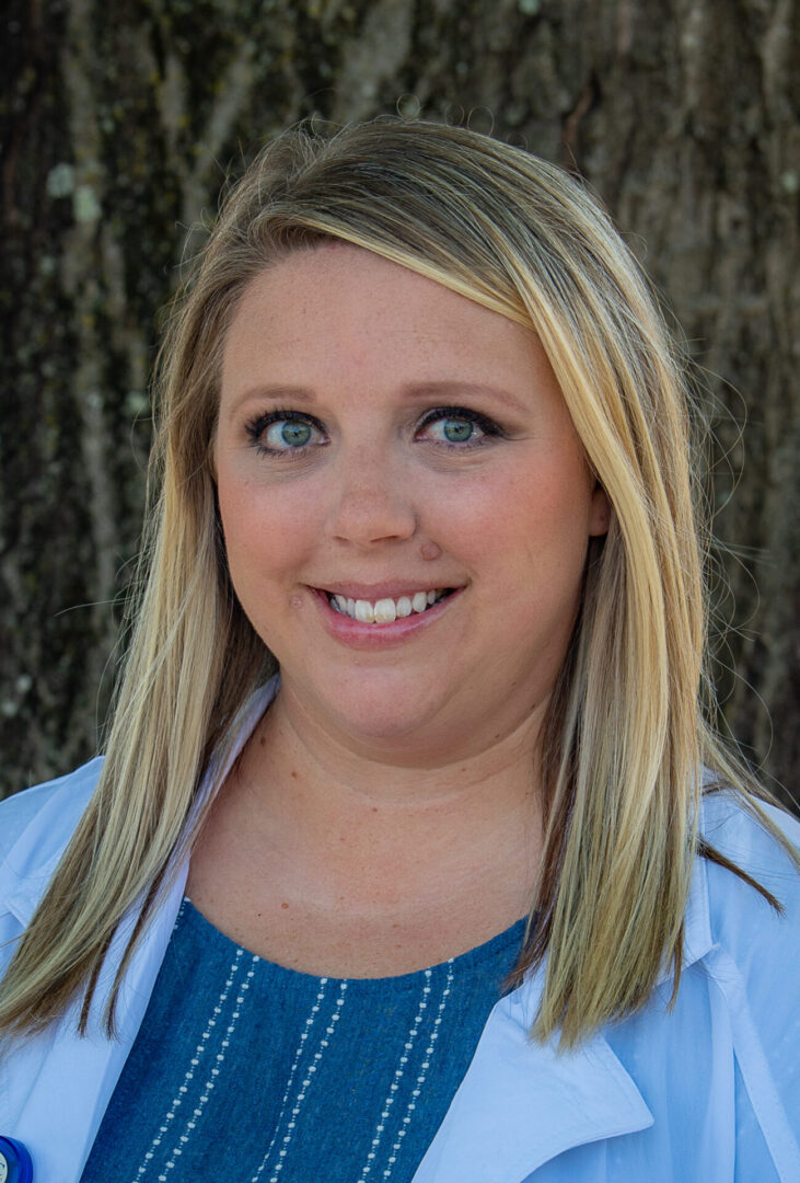 A woman with blonde hair and blue eyes.